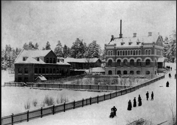 Historisk vinterbild av fabriksbyggnad